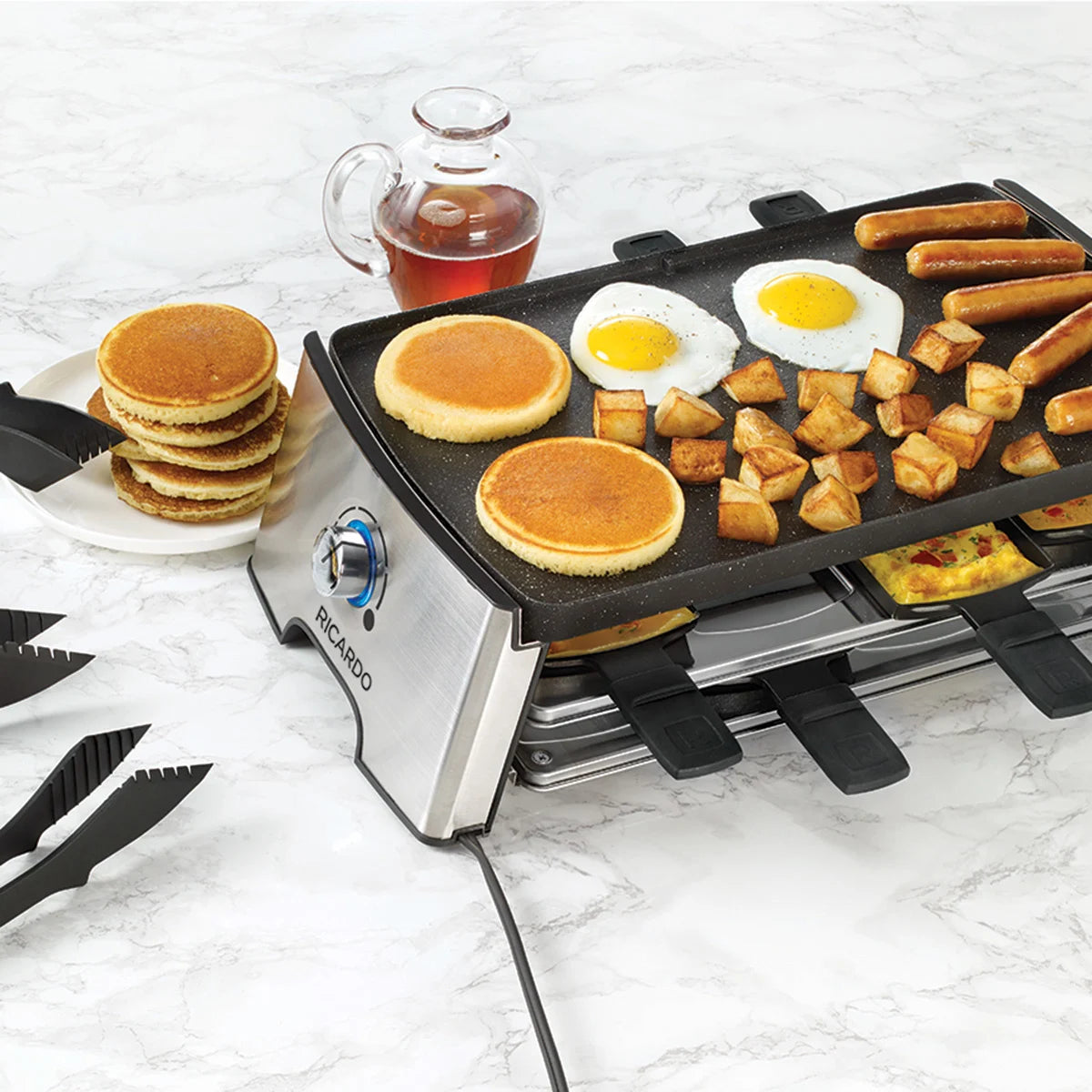 Ensemble à raclette électrique réversible