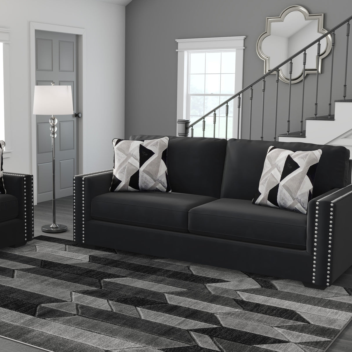 Sofa condo en tissu noir avec coussins - Gleston