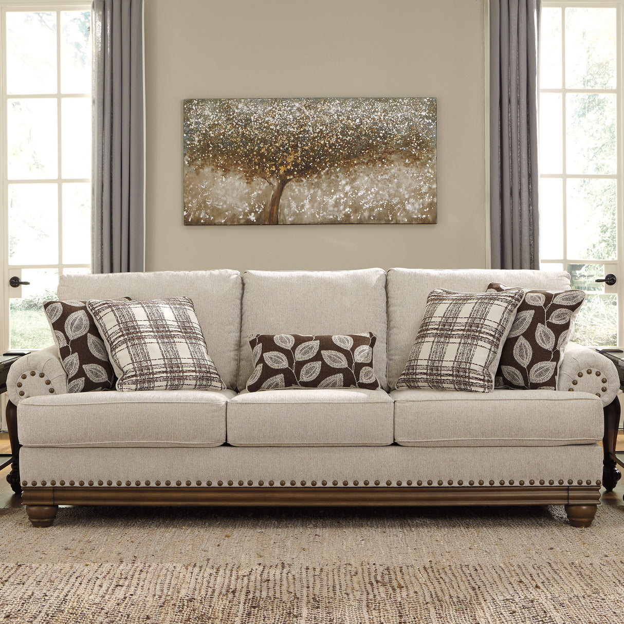 Sofa en tissu beige pâle avec coussins - Harleson