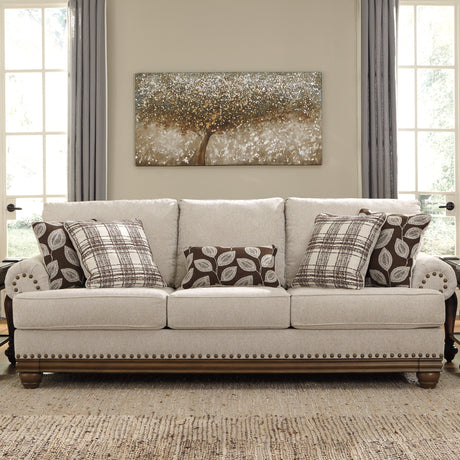 Sofa en tissu beige pâle avec coussins - Harleson