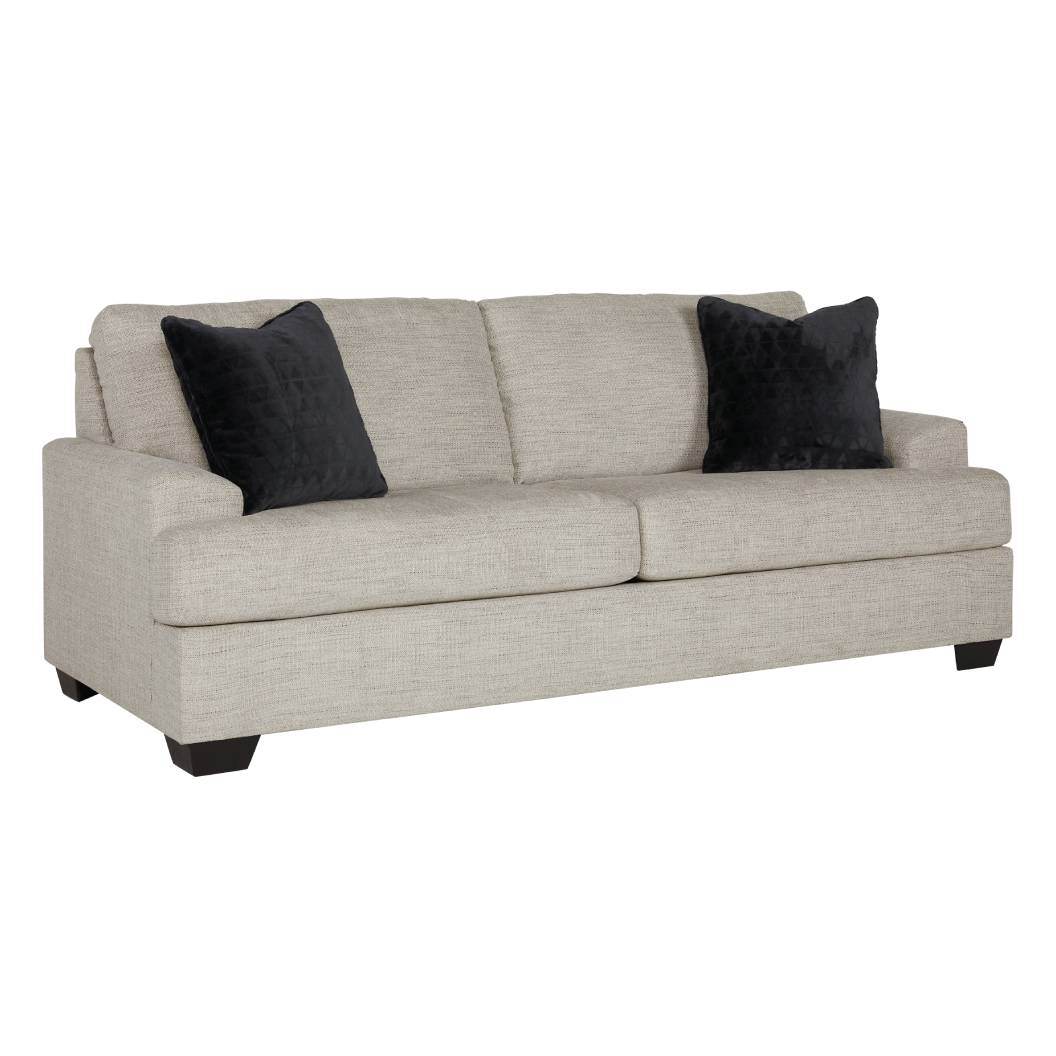 Sofa condo en tissu beige pâle avec coussins - Vayda