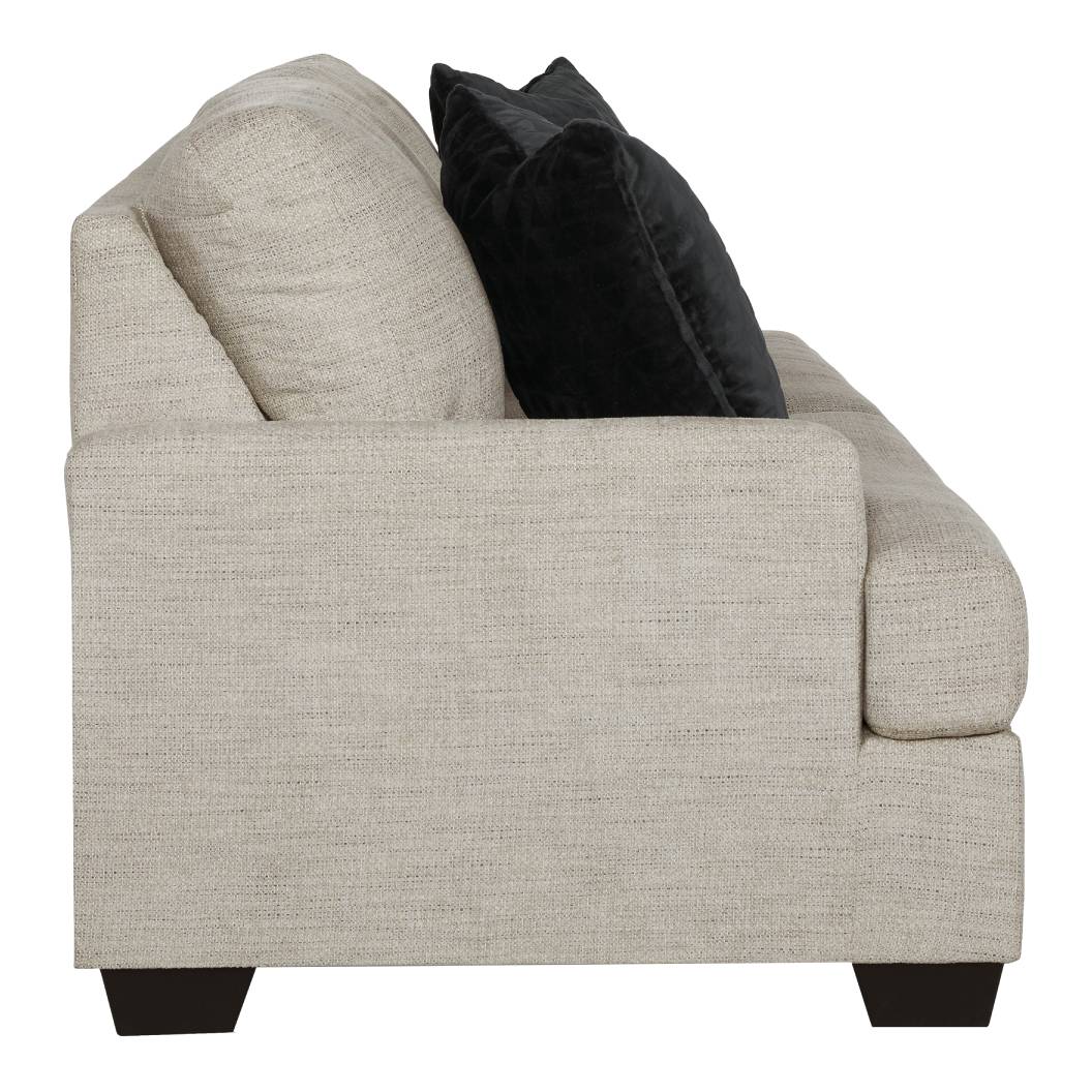 Sofa condo en tissu beige pâle avec coussins - Vayda