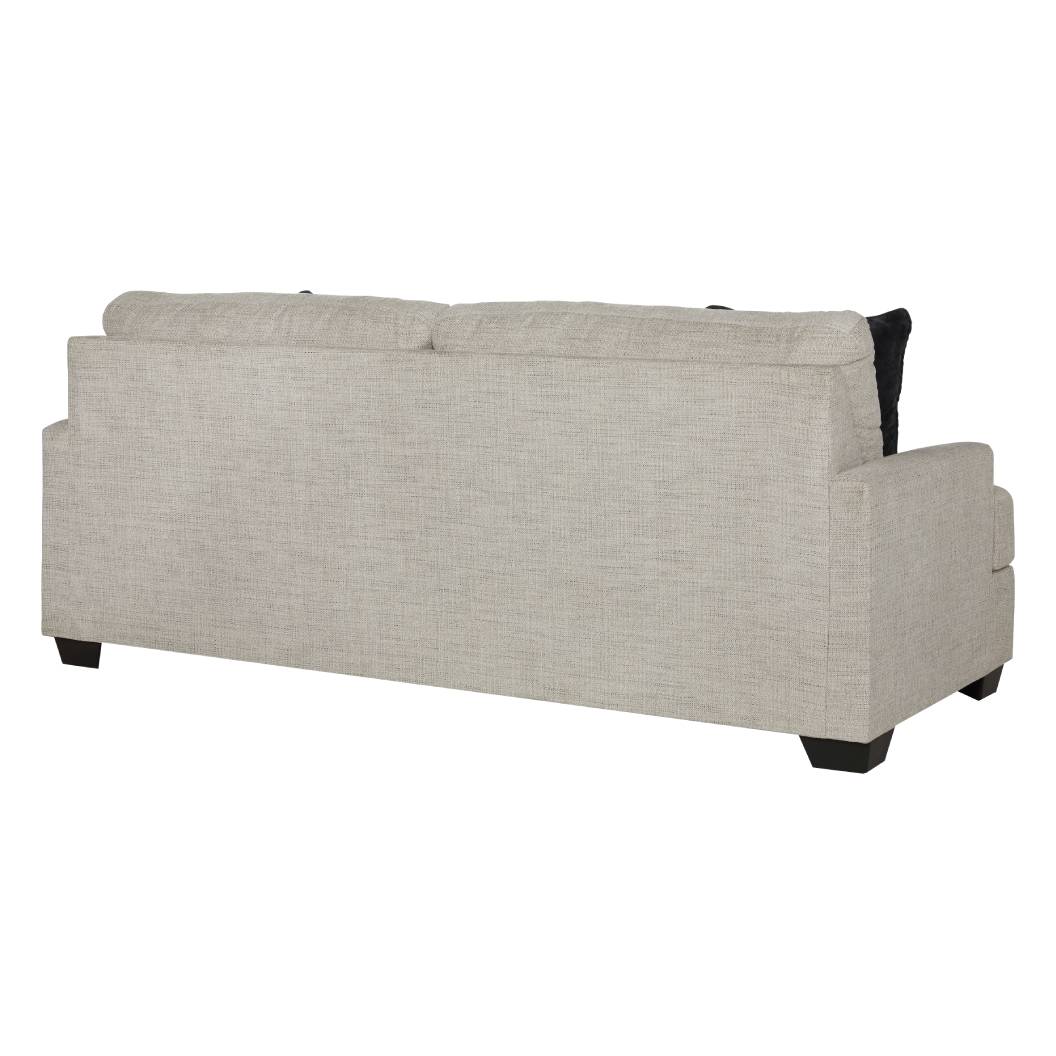 Sofa condo en tissu beige pâle avec coussins - Vayda