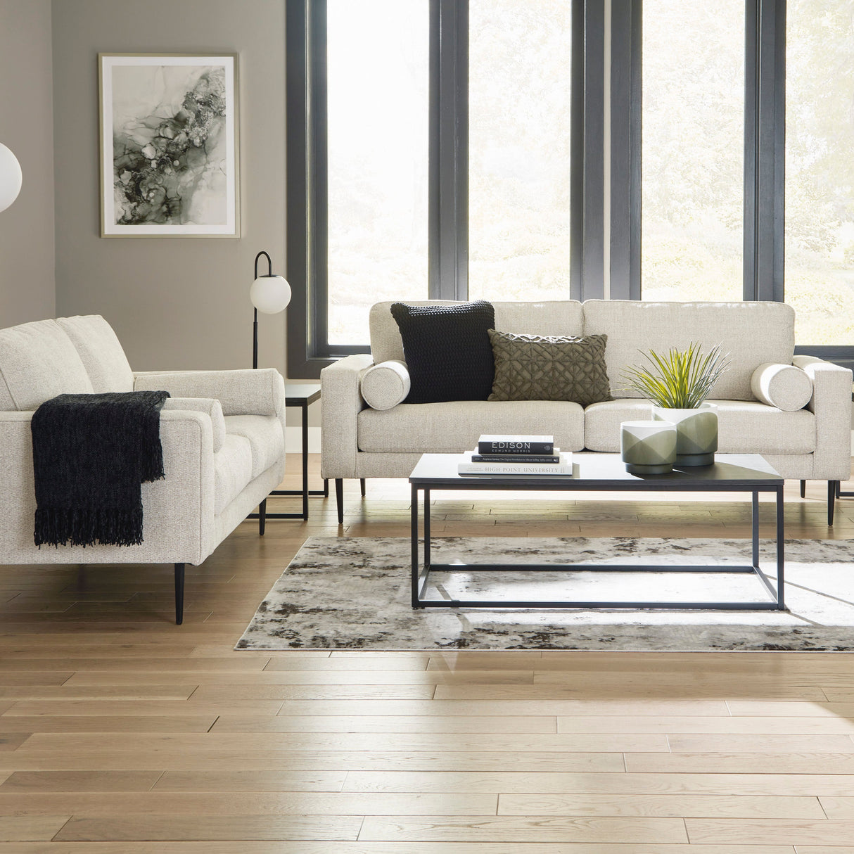 Sofa condo en tissu crème avec coussins - Hazela