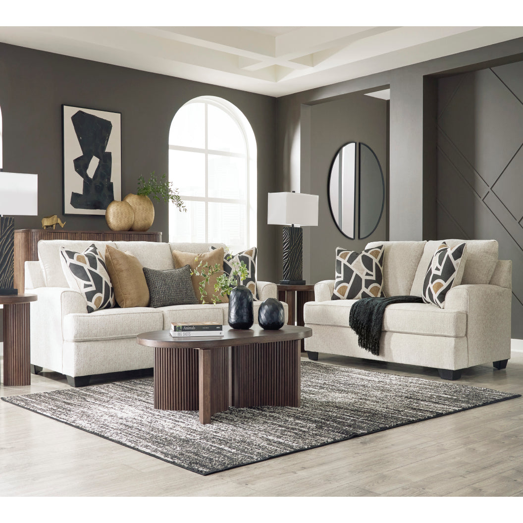 Sofa en tissu beige pâle avec coussins - Heartcort