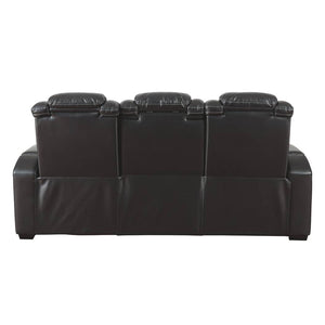 Sofa aspect cuir noir motorisé avec table rabattable - Party Time