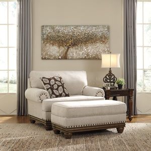 Ottoman en tissu beige pâle avec garniture cloutée - Harleson
