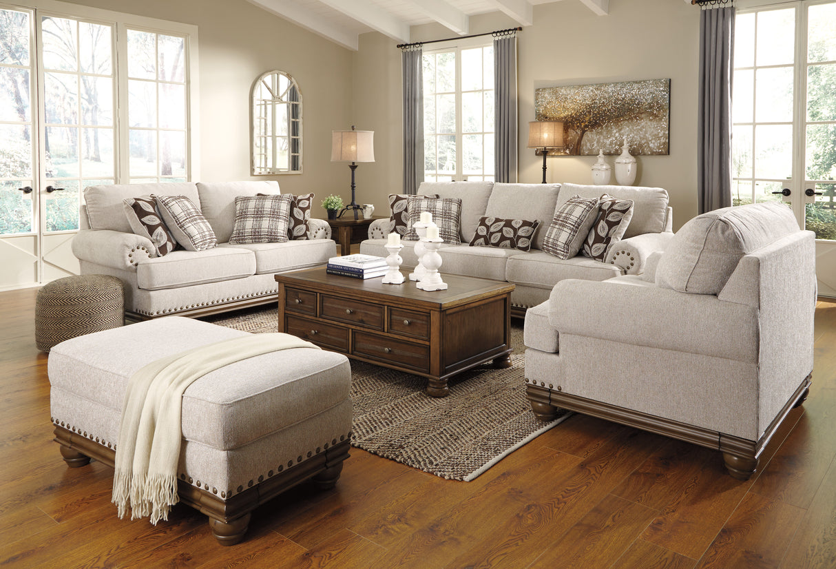 Ottoman en tissu beige pâle avec garniture cloutée - Harleson