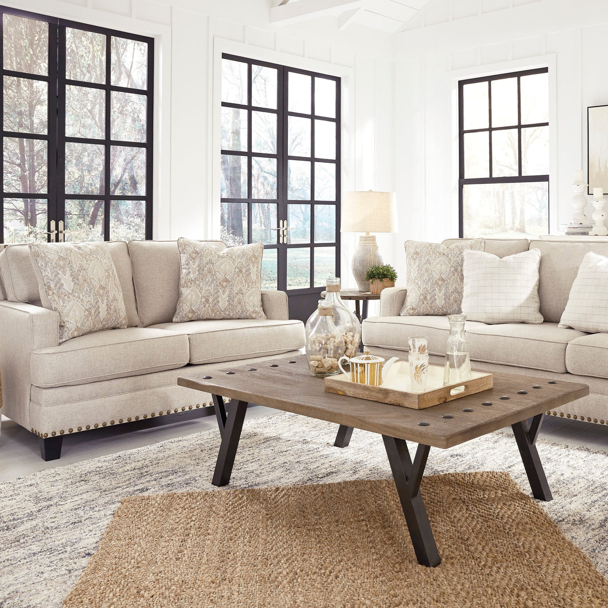 Causeuse en tissu beige effet lin avec coussins - Claredon