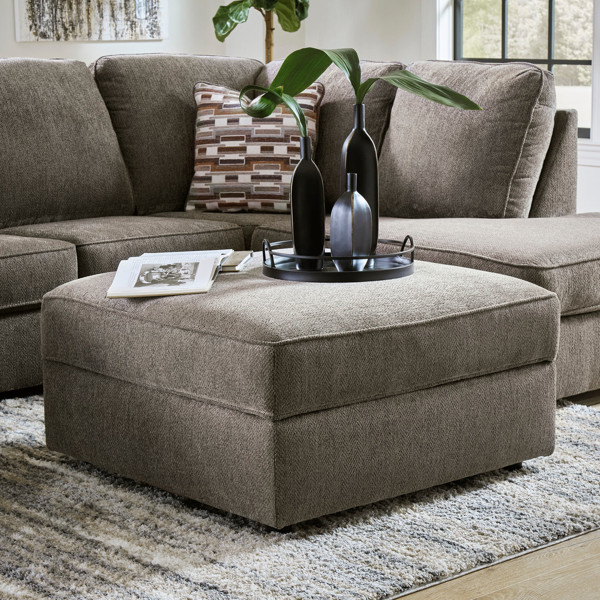 Ottoman avec rangement OPhannon en tissu gris