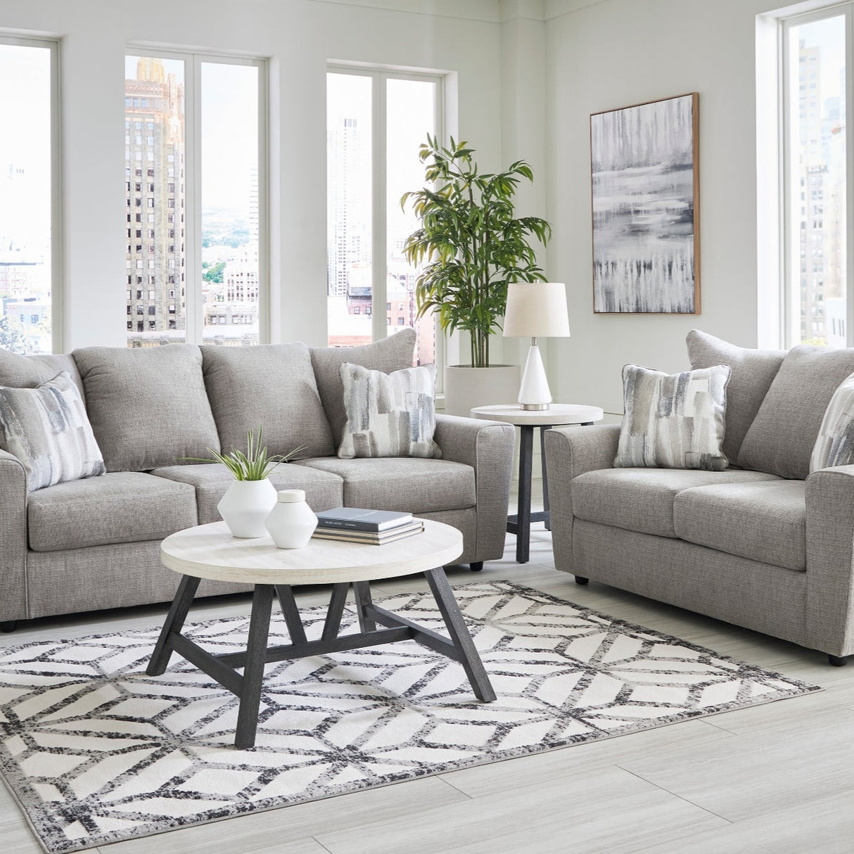 Sofa en tissu gris avec coussin - Stairatt