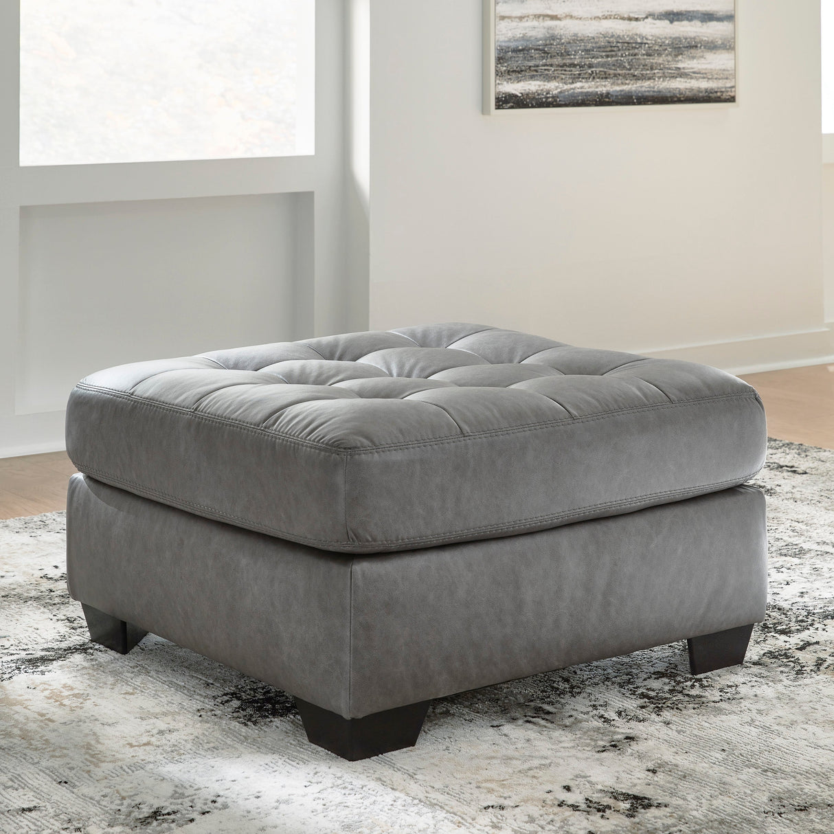 Ottoman aspect cuir gris surdimensionné - Clairette