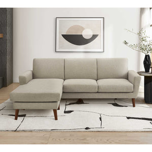 Sofa en tissu brun clair avec chaise longue