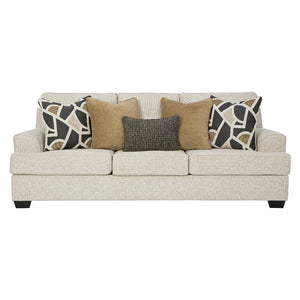 Sofa en tissu beige pâle avec coussins - Heartcort