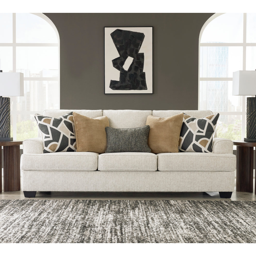 Sofa en tissu beige pâle avec coussins - Heartcort