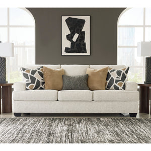 Sofa en tissu beige pâle avec coussins - Heartcort